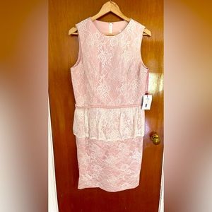 Ivory/blush dress from Mirabella’s Bridal Boutique, designed by Andrew Adela.